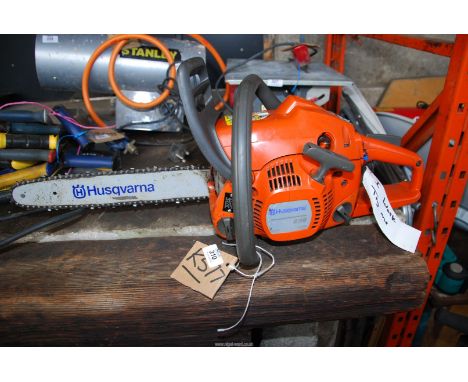 A Husqvarna chainsaw, chain-brake working, 13" cutter bar.