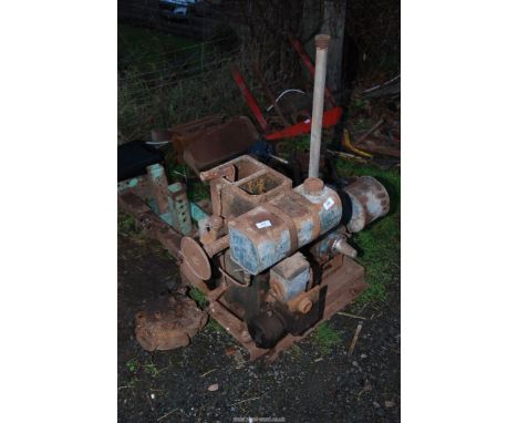 A Lister "D" petrol Engine having good compression and mounted on a base with a milking machine vacuum pump, understood to ha