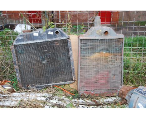 A commercial radiator and one International tractor radiator.