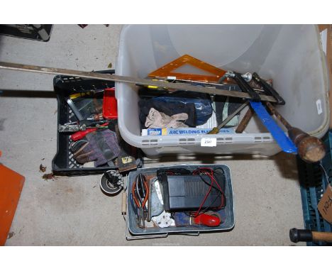 A large sash clamp, battery charger, various tools, etc.