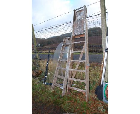 Two wooden step ladders.