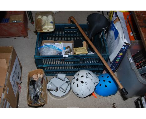 A quantity of cycling helmets, a toilet seat, bicycle seat, door handles, walking stick, door furniture, etc.