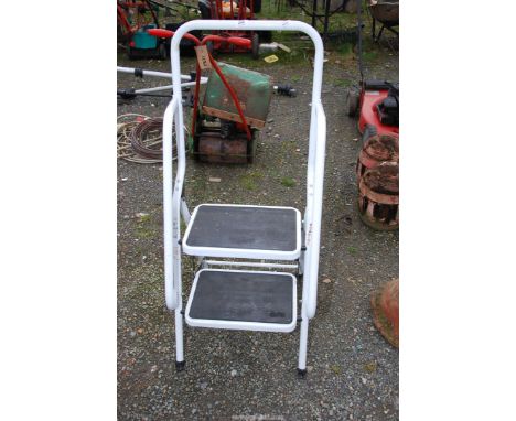 A two rung step ladder with rails.