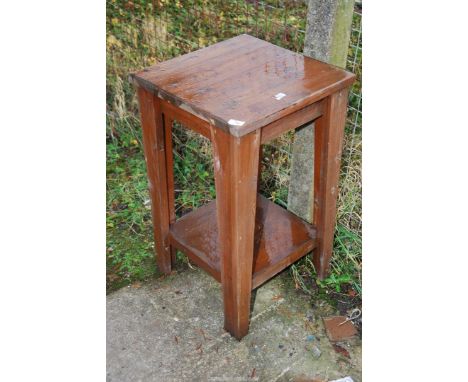 A square table with lower shelf, 18 1/2 x 31" high.