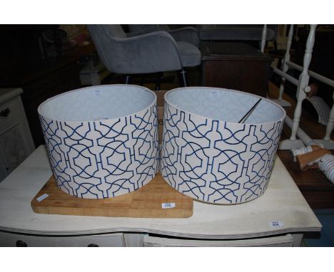 Two lamp shades and a chopping board.