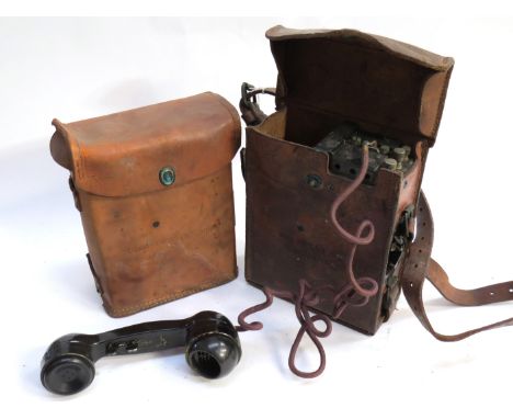 A US Army Signal Corps telephone set consisting of leather cased Telephone EE-8-A and EE-8-B and cable reel