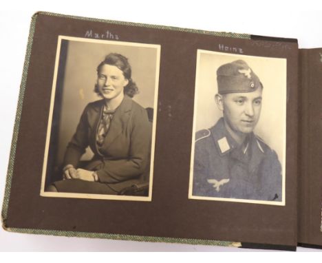 A WWII German army photo album with photographs of soldiers in action, resting, motor cycles, aircraft etc, taken on the Russ