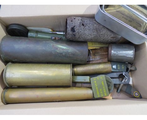 A box of mixed miltaria including shell cases, model Spitfire and brass button polishers 