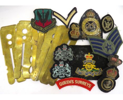 A collection of military buttons, cloth insignia and button polishers etc 
