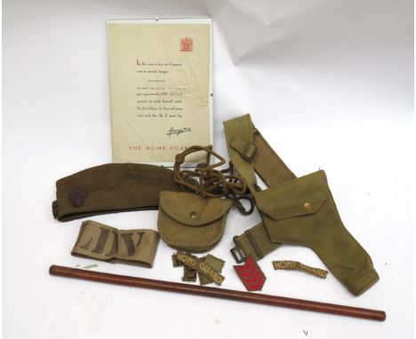 A WWII Home Guard collection consisting of holster and lanyard, forage cap, swagger stick, Home Guard certificate, ephemera i