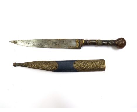 An African dagger with sectional stone grip, gilt detail and scabbard