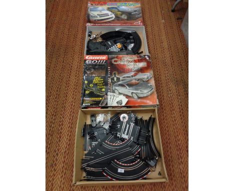 A CARRERA GO111 1:43 SCALE SLOT RACING SYSTEM 'JAMES BOND CASINO ROYALE' AND A BOXED SCALEXTRIC SET 