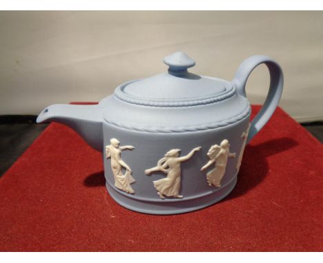 A BLUE WEDGEWOOD JASPERWARE TEAPOT WITH DANCING FIGURES 