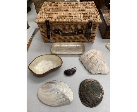 A WICKER PICNIC BASKET, THREE SHELLS, TWO PEARLESQUE DISHES AND A SNUFF BOX 