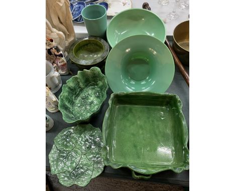 SEVEN ITEMS OF GREEN CERAMIC WARE TO INCLUDE A LARGE SERVING DISH AND A BOWL AND PLATTER IN THE FORM OF CABBAGE LEAVES ETC 