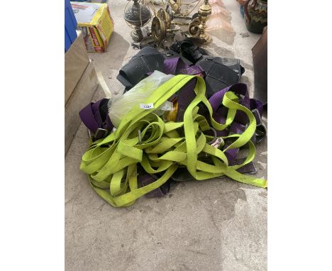 A LARGE ASSORTMENT OF CLIMBING GEAR TO INCLUDE HARNESSES, STRAPS AND TOOL BELTS ETC 