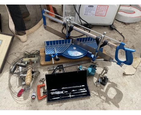 AN ASSORTMENT OF HAND TOOLS TO INCLUDE A MITRE SAW, CLAMPS AND A DRAWING SET 