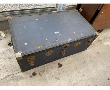 A COMPRESSED FIBRE TRAVELLING TRUNK, 36X20" 