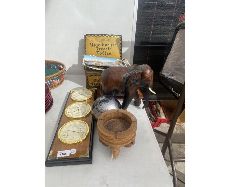 AN ASSORTMENT OF ITEMS TO INCLUDE A TREEN ELEPHANT, A GLOBE AND A CLOCK AND BAROMETER 