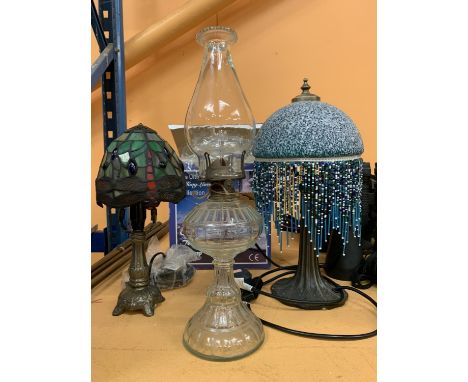 A BOXED TIFFANY LAMP, A BEADED ART NOUVEAU DOMED LAMP AND A GLASS OIL LAMP 