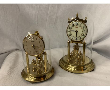 A KUNDO ANNIVERSARY GLASS DOMED CLOCK H: 9" AND A BENTIMA GLASS DOMED CLOCK 