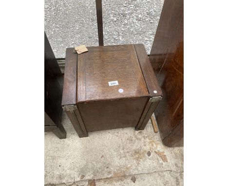 AN EARLY 20TH CENTURY OAK STICK/COAL BOX WITH APPLIED METALWARE DECORATION 