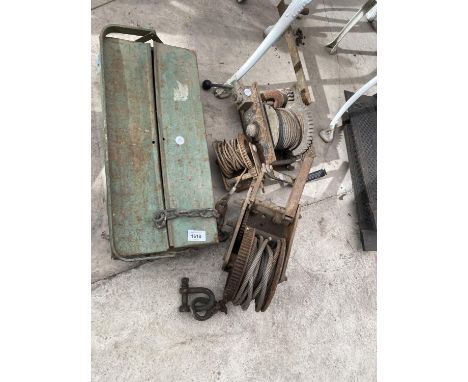 A VINTAGE METAL TOOL BOX AND THREE WINCHES 