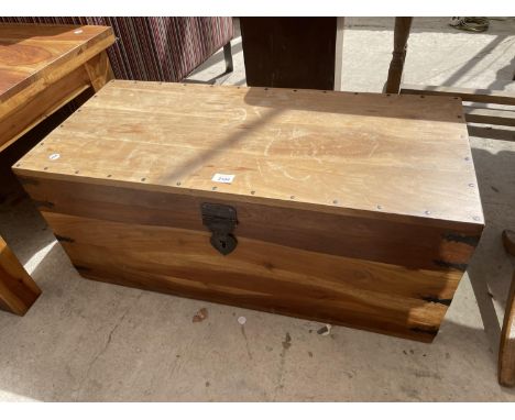 A MODERN HARDWOOD TRUNK WITH METAL STUDS 