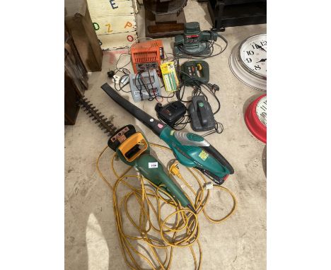 AN ASSORTMENT OF POWER TOOLS TO INCLUDE A HEDGE CUTTER, A LEAF BLOWER AND A SANDER ETC 