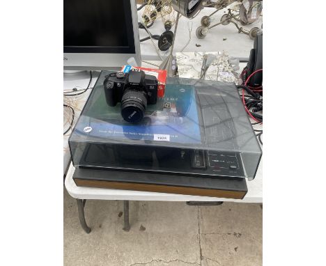 A CANON EOS 5000 CAMERA AND A FIDELITY RECORD PLAYER 