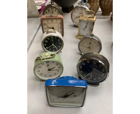 A SELECTION OF EIGHT ALARM CLOCKS AND A CARRIAGE CLOCK 