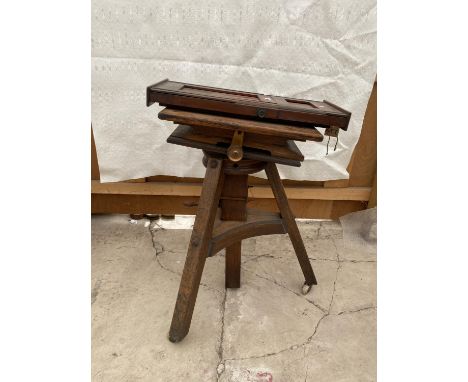 A VINTAGE WOODEN CAMERA TRIPOD 