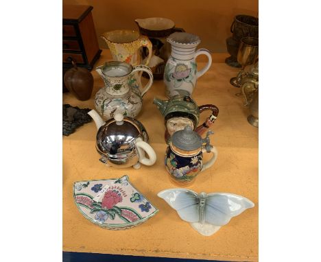 A COLLECTION OF CERAMIC JUGS TO INCLUDE A TEA POT AND A CHARACTER JUG 
