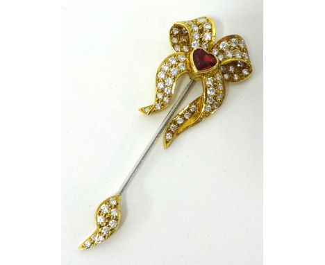 A fine 18ct ruby and diamond jabot pin set with 63 diamonds and heart shaped ruby RG Ltd, with receipt dated 1991 £1400