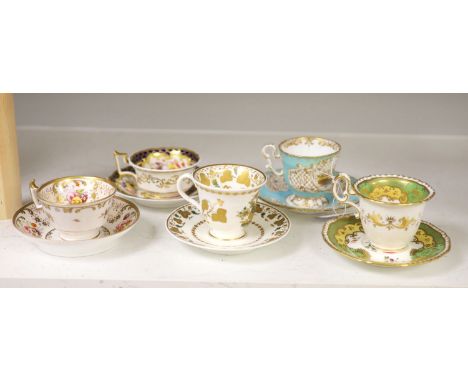 A Spode cup and saucer decorated with raised gilt birds and a basket with green leaves, marked Spode 3916, a Copeland and Gar