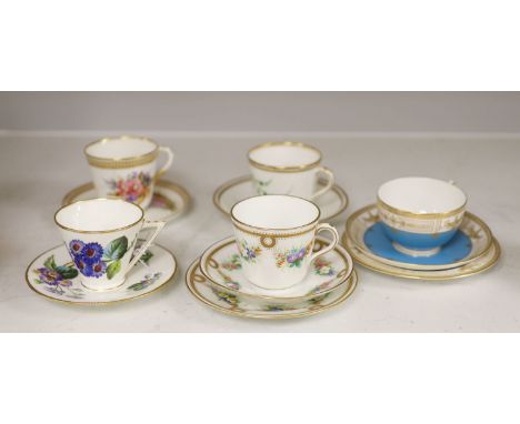 A Royal Worcester jewelled coffee cup and saucer painted with heathers by George Hundley, a Royal Worcester jewelled trio wit