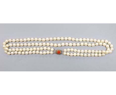 A double strand cultured pearl necklace, with coral bead set 800 white metal clasp, 43cm, gross 51 grams, one bead diameter 6