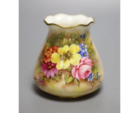 A Royal Worcester sack shape vase, with pie crust rim, painted with a fine floral study by J Freeman, signed, black date mark