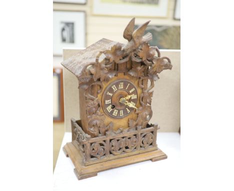 A late 19th century Black Forest cuckoo mantel clock, height 45cm