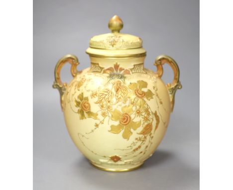 A Royal Worcester two handled ovoid vase moulded and gilded with flowers on a blush ivory ground, shape 1515 date code for 18