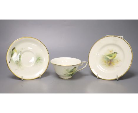 A Royal Worcester teacup, saucer and side plate, each unusually painted with a thrush on a branch by E. Townsend, signed blac