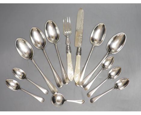A Victorian mother of pearl handled silver knife and fork, George Unite, Birmingham, 1868, a silver caddy spoon, five silver 