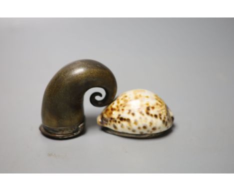 A 19th century white metal mounted horn snuff mull, 7cm and a similar white metal mounted cowrie shell snuff box, 73mm(a.f.),