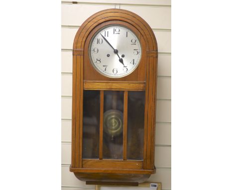 A 1920's walnut wall clock
