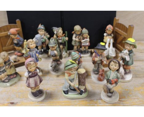 A COLLECTION OF ASSORTED GOEBEL AND HUMMEL FIGURES TO INCLUDE BOOKENDS