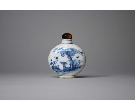 A Chinese blue and white snuff bottle, probably QianlongOf moon form and decorated with a deer resting beneath a pine tree to