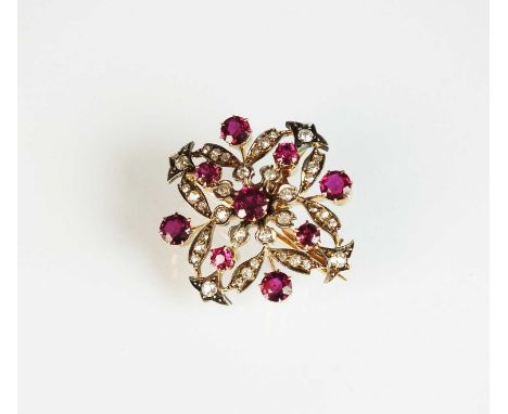 A late 19th century diamond and ruby brooch/pendant, designed as a central round mixed cut ruby claw set to openwork mount se