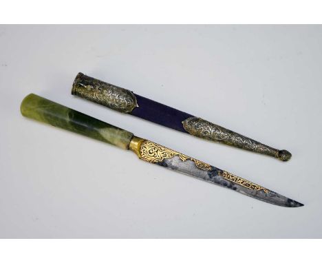 An Indian steel dagger, 18th/19th centuryThe 6" single edge tapering blade decorated with koftgari gilt spandrel at the base,