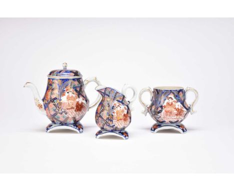 A Japanese Imari three-piece tea set, Meiji periodOf ovoid form with triform feet, decorated with figures on a fenced veranda