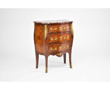 A French, Louis XV style, rosewood and sycamore veneered, petite bombe commode, dated 1902, inlaid with floral marquetry pane
